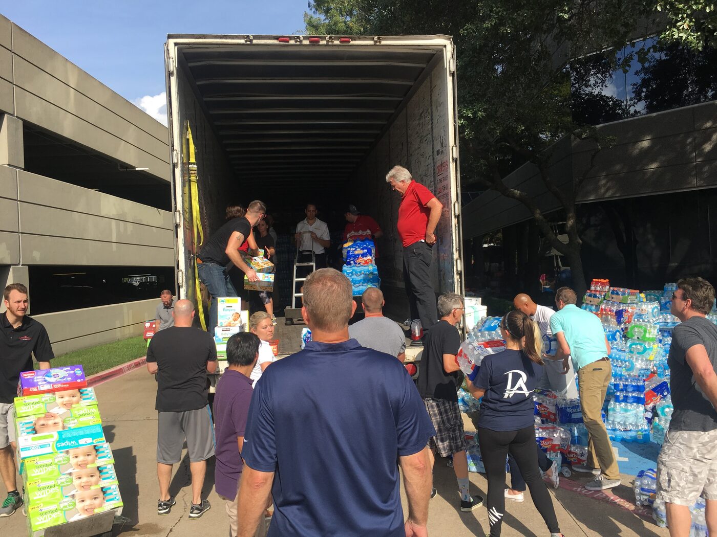 Myers team loading a truck during a community donation drive
